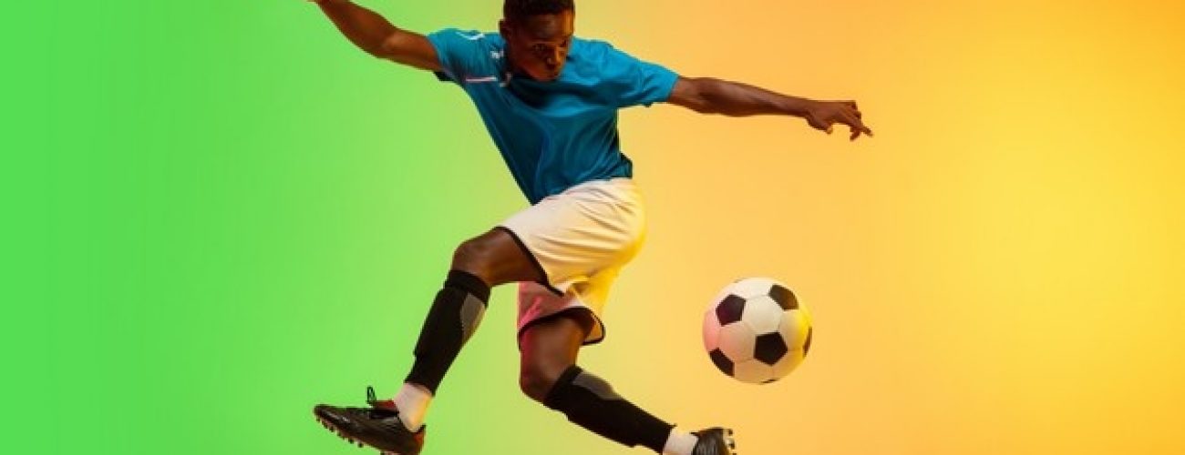 male-soccer-football-player-training-action-isolated-gradient-studio-neon-light_155003-15990